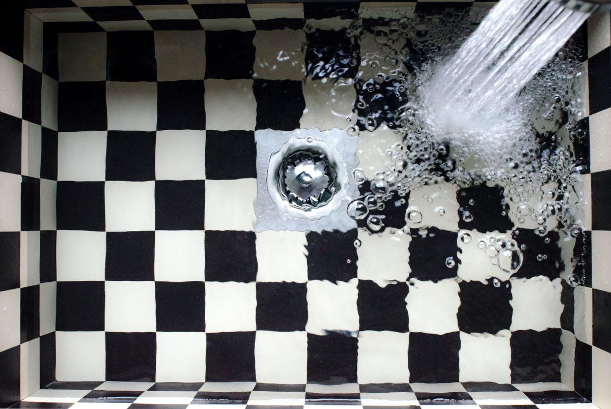 Water swirling down a sink drain